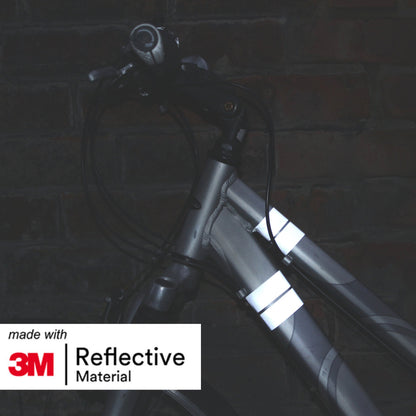 Image of bike with silver reflective tape attached in low lighting. 