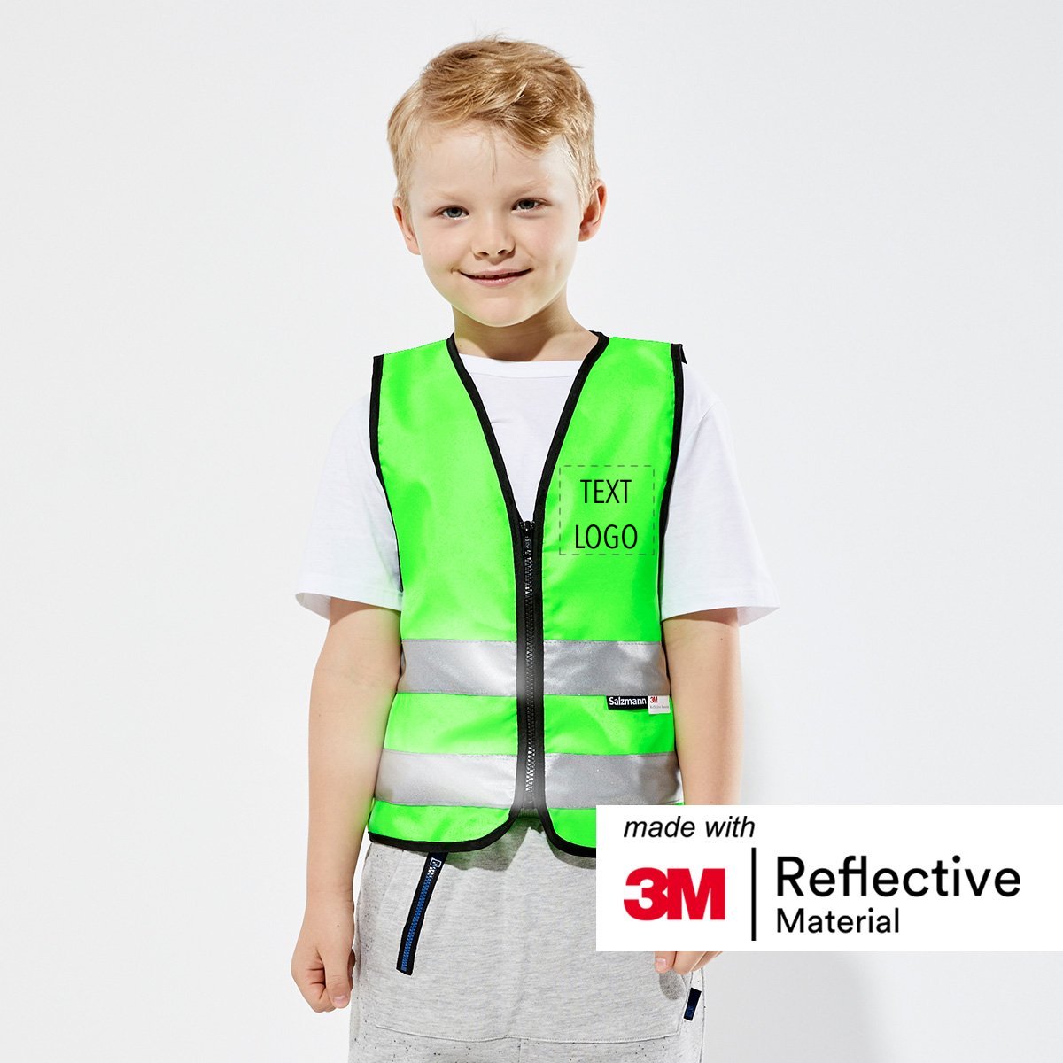 Child wearing green children's safety vest with custom print. 