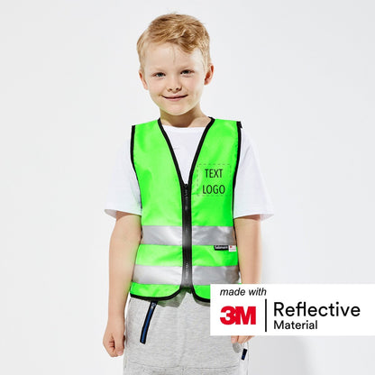 Child wearing green children's safety vest with custom print. 