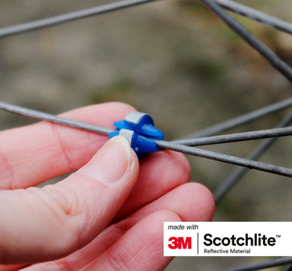 Image of person putting colourful spoke bead on spoke.